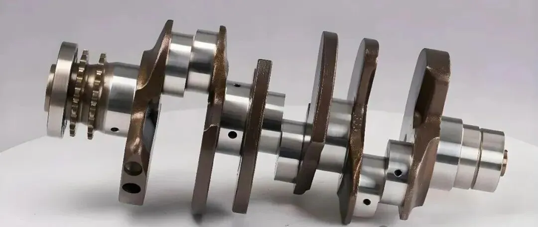 Automotive crankshaft component showing oil hole positions drilled with solid carbide coolant-through twist drills in mass production