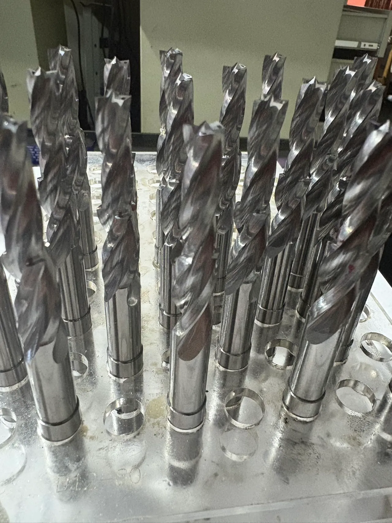 Three-point flat bottom solid carbide drill with coolant-through design